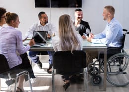 Wheelchair employee sitting in a meeting